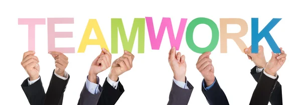 Ondernemers houden het woord Teamwork — Stockfoto