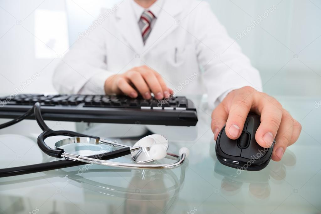 Doctor's Hand On Mouse And Keyboard