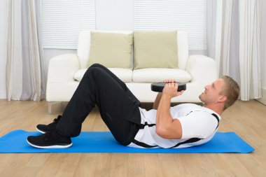 Man Exercising With Plate clipart