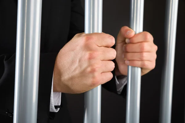Businessman Holding Bars In Jail — Stock Photo, Image
