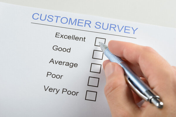 Person Filling Customer Survey Form