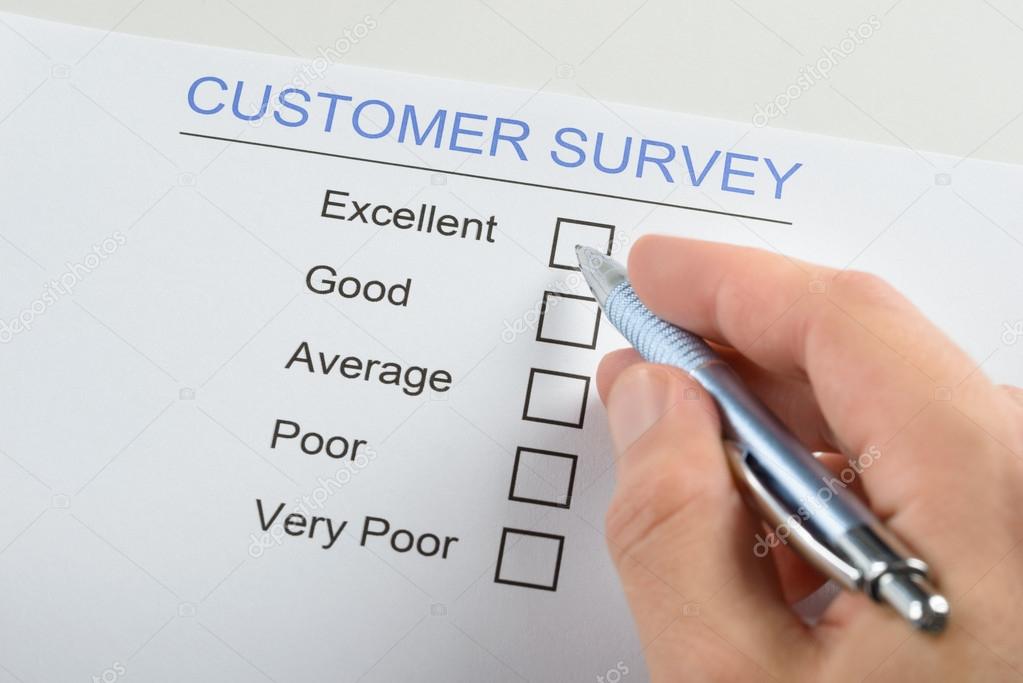 Person Filling Customer Survey Form
