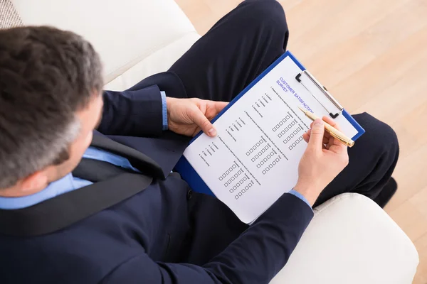 Businessman Filling Customer Survey Form — Stock Photo, Image