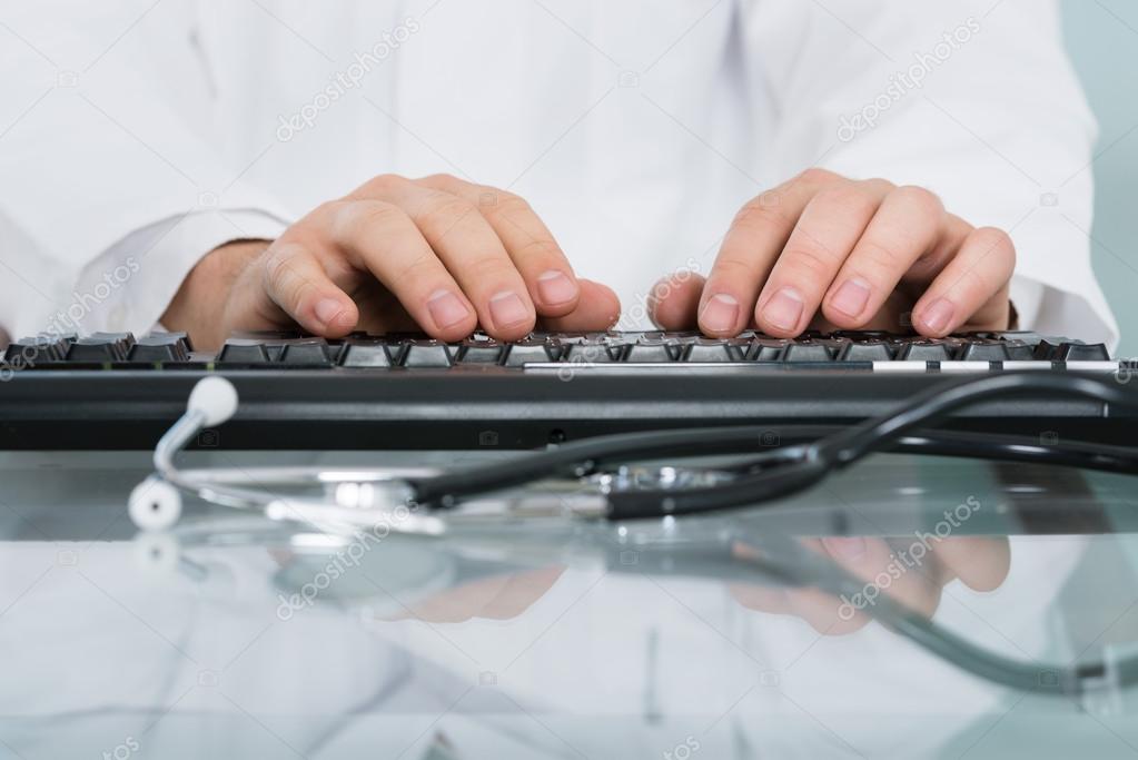 Doctor Typing On Keyboard