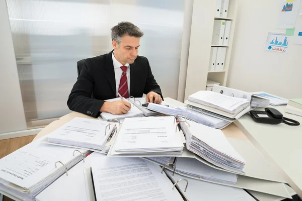 Businessman With Heap Of Folders — Stock Photo, Image