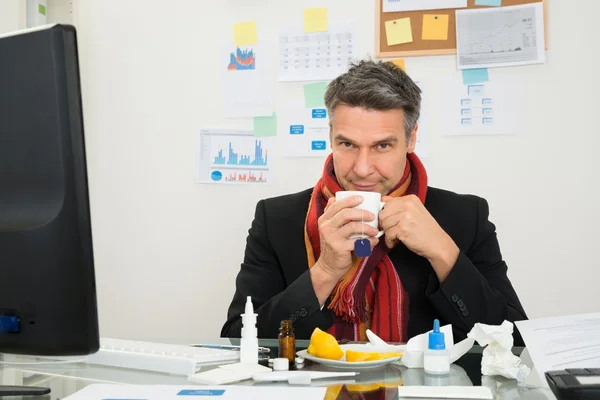 Businessman With Muffler Drinking Tea — Stock Photo, Image