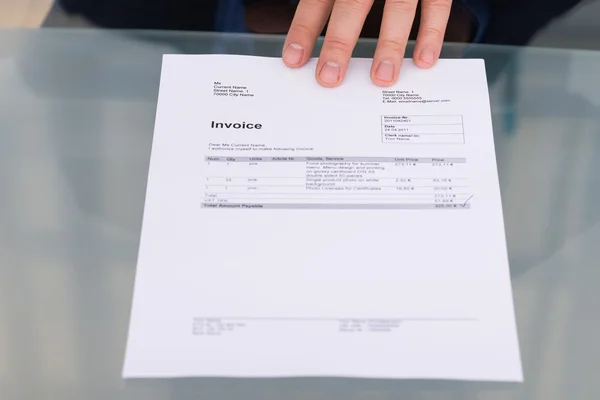 Hand With Invoice On Desk — Stock Photo, Image