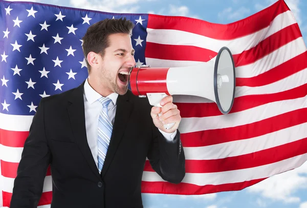 Businessman Shouting Through Megaphone — Stock Photo, Image