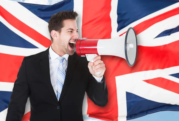 Businessman Shouting Through Megaphone — Stock Photo, Image