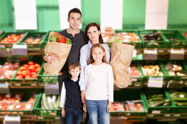 Happy Family In Supermarket