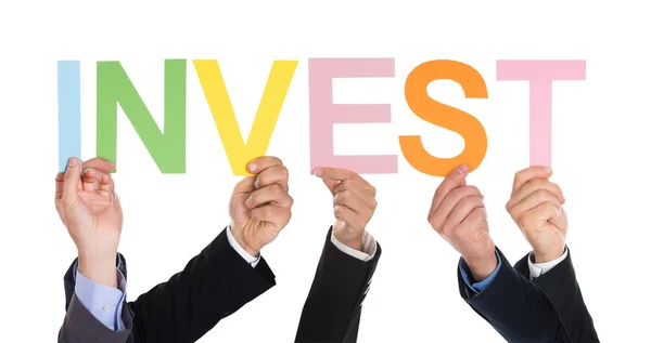 Businesspeople Hands With Text Invest — Stock Photo, Image