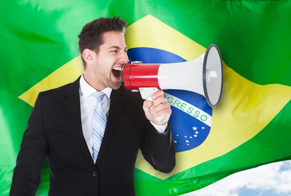 Businessman Shouting Through Megaphone — Stock Photo, Image