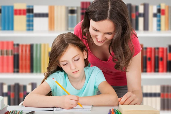 Mother And Daughter Studying Stock Picture