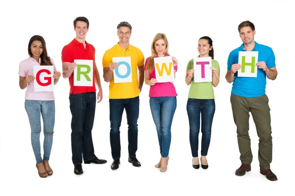 Amigos haciendo crecimiento de la palabra — Foto de Stock