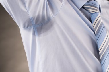 Man Sweating Under Armpit clipart