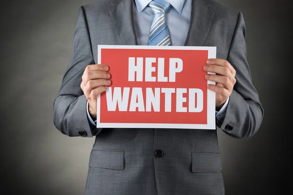 Businessman Holding Help Wanted Placard — Stock Photo, Image
