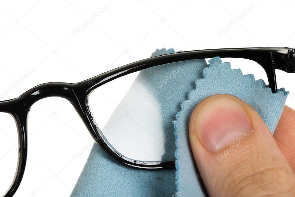 Person Cleaning Eyeglasses