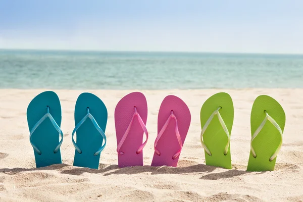 Pairs Of Flip-flops On Beach — Stock Photo, Image