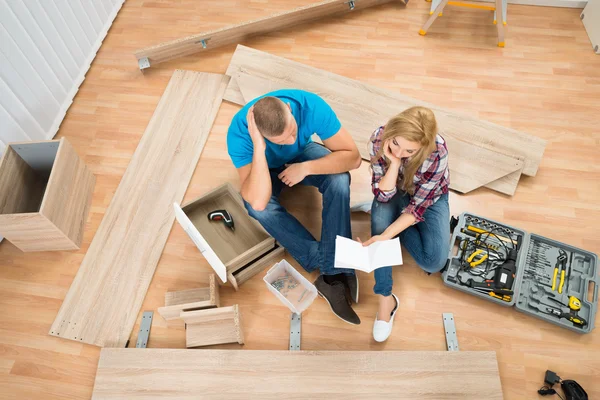 Couple With Disassembled Furniture — Stock Image Couple With Disassembled Furniture Stock Image