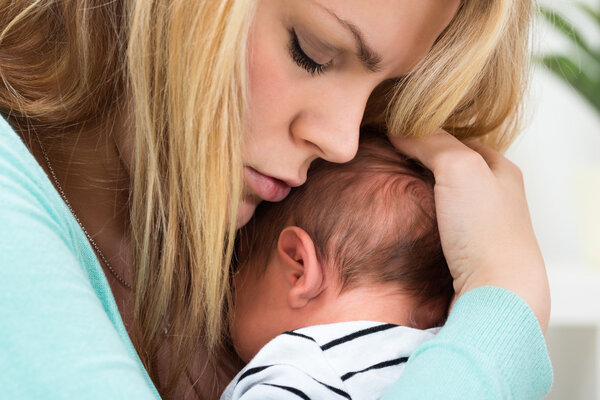 Mother Carrying Baby