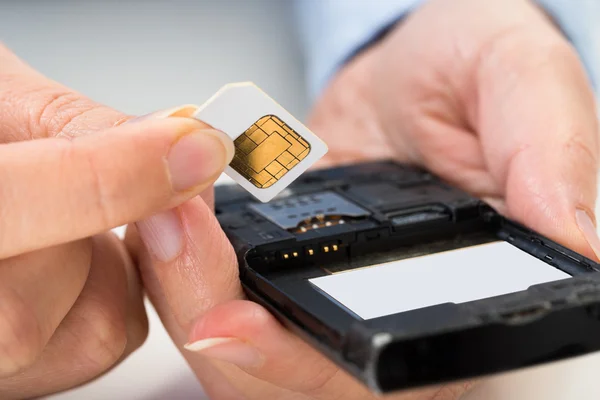 Hands Inserting Sim Card — Stock Photo, Image