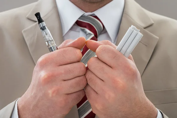 Businessperson Holding Electronic Cigarette — Stock Photo, Image