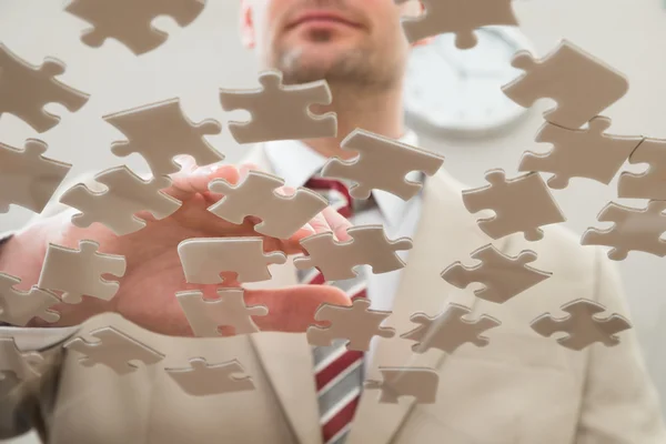 Businessman Separating Puzzles — Stock Photo, Image