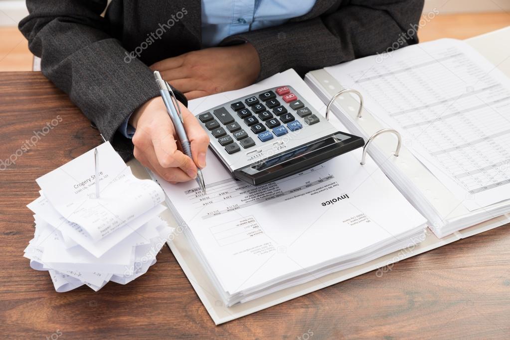 Businessperson Calculating Bills