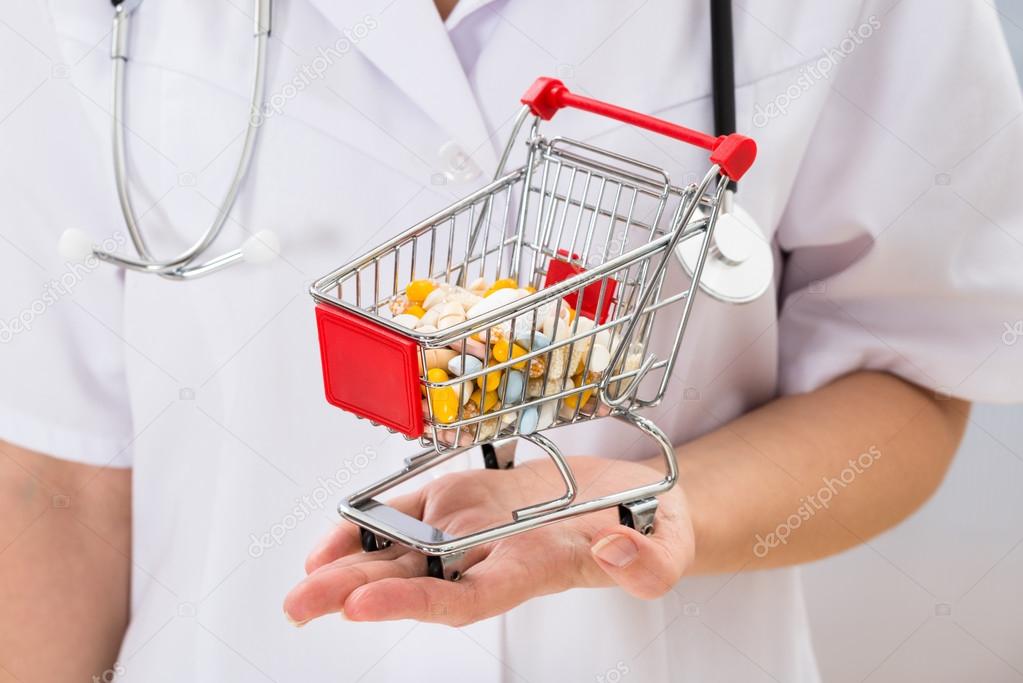 Doctor Holding Cart With Pills