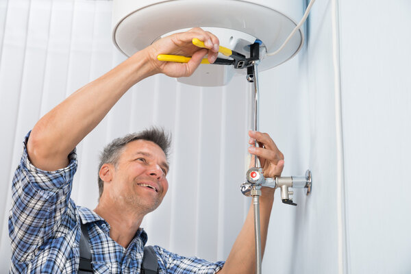 Plumber Repairing Water Heater