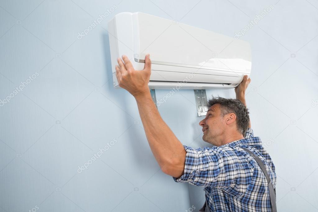 Technician Fixing Air Conditioner