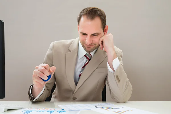 Businessman Squeezing Stressball — Stock Photo, Image