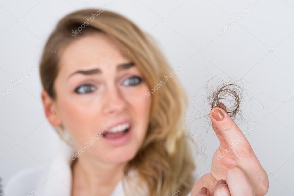 Woman Holding Loss Hair