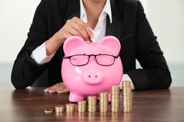 Businesswoman Inserting Coin — Stock Photo, Image