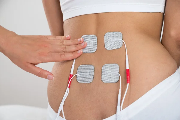 Therapist Placing Electrodes — Stock Photo, Image