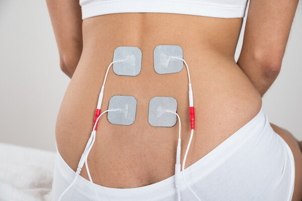 Woman With Electrodes On Back