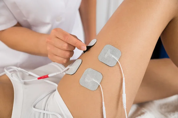 Therapist Placing Electrodes — Stock Photo, Image