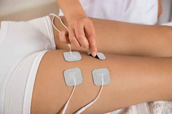 Therapist Placing Electrodes — Stock Image Therapist Placing Electrodes Royalty Free Stock Photos