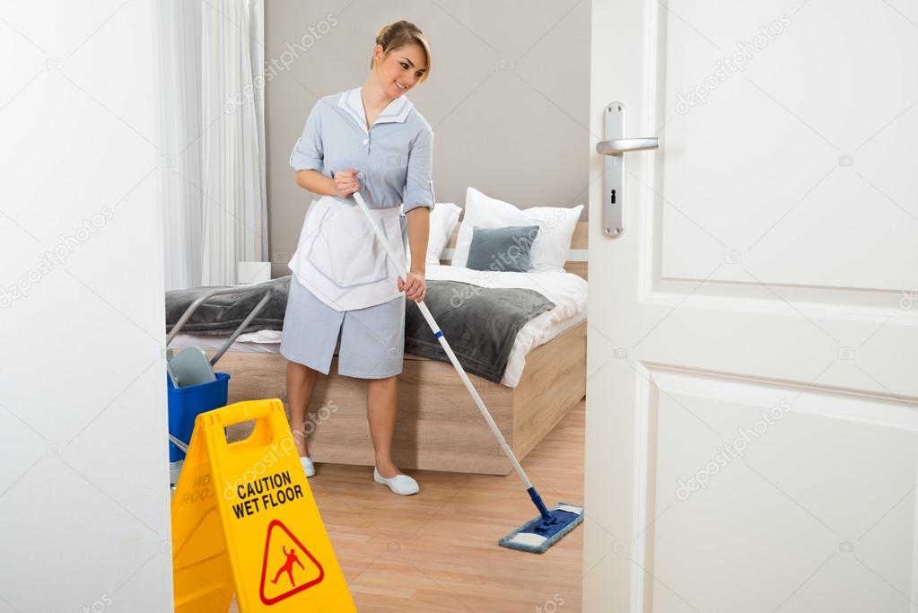 Maid Cleaning Floor