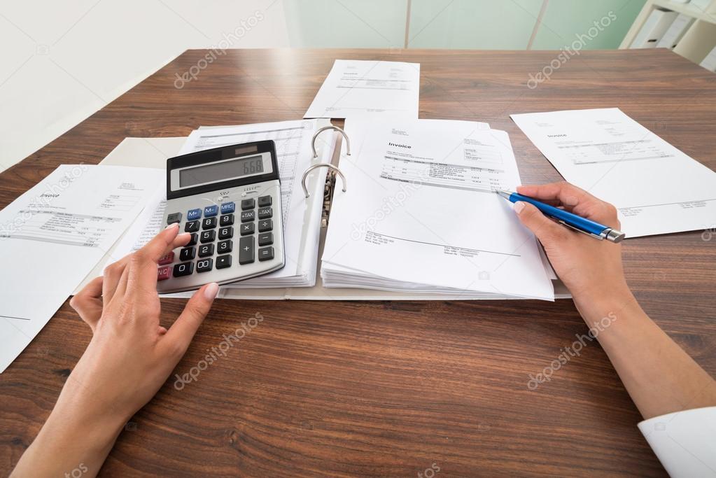 Businessperson Hands Calculating Bill