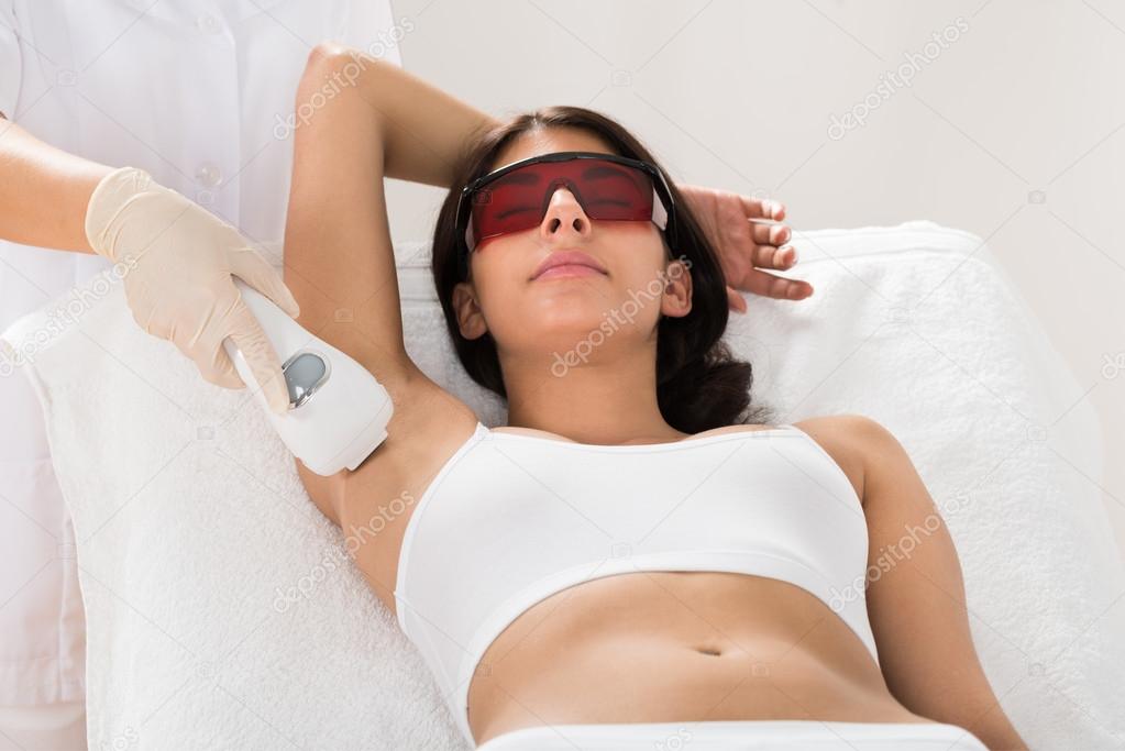 Woman Receiving Epilation Laser Treatment