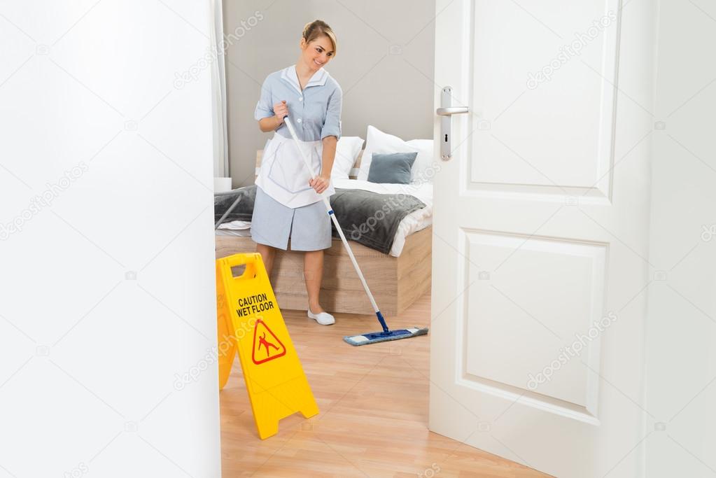 Maid Cleaning Floor