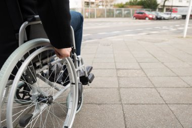 Man Sitting On Wheelchair clipart