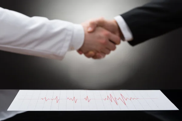 Businessman And Doctor Shaking Hands — Stock Photo, Image