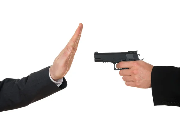 Empresário apontando com arma — Fotografia de Stock