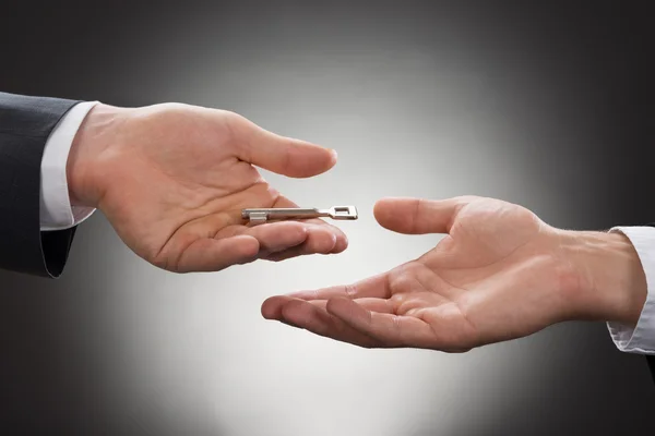 Real Estate Agent Giving Key — Stock Photo, Image