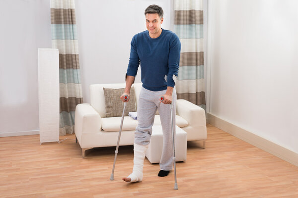 Disabled Man Using Crutches