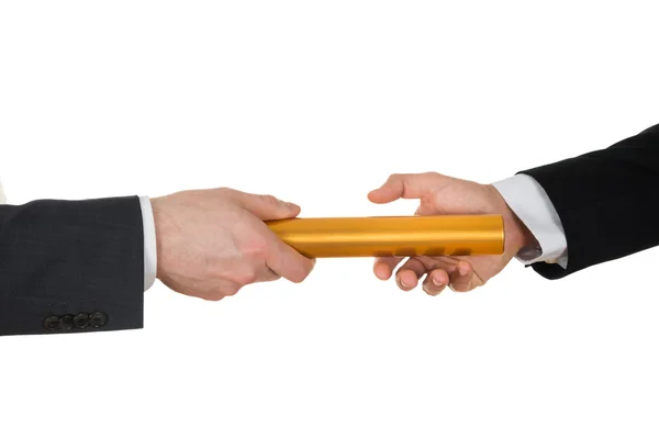 Hands Passing Golden Relay Baton — Stock Photo, Image