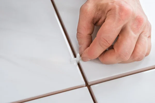 Hand Placing Spacers Between Tiles — Stock Photo, Image