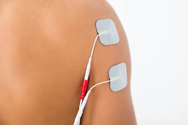 Person With Electrodes On Shoulder — Stock Photo, Image